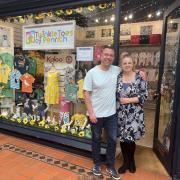 Twinkletoes of Penrith Owners Andrew and Liane Dixon next to their award-winning shop window display