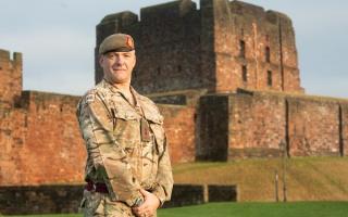 Nick Kennon stands in front of Carlisle Castle