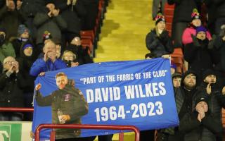 The flag in tribute to David Wilkes on show in the away end at Barnsley last week