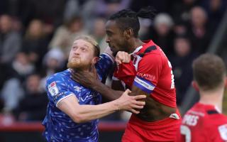 Orient's Omar Beckles gets to grips with United's Luke Armstrong