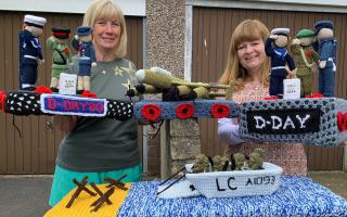 Elaine Wright and Tracy Johnson show off their knitted masterpiece to commemorate 80 years since D-Day