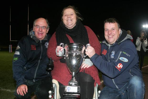Champions: Workington Comets won the Knockout Cup last night as team manager Tony Jackson, owner Laura Morgan and co-promoter Steve Whitehead celebrate (Photo: David Payne)