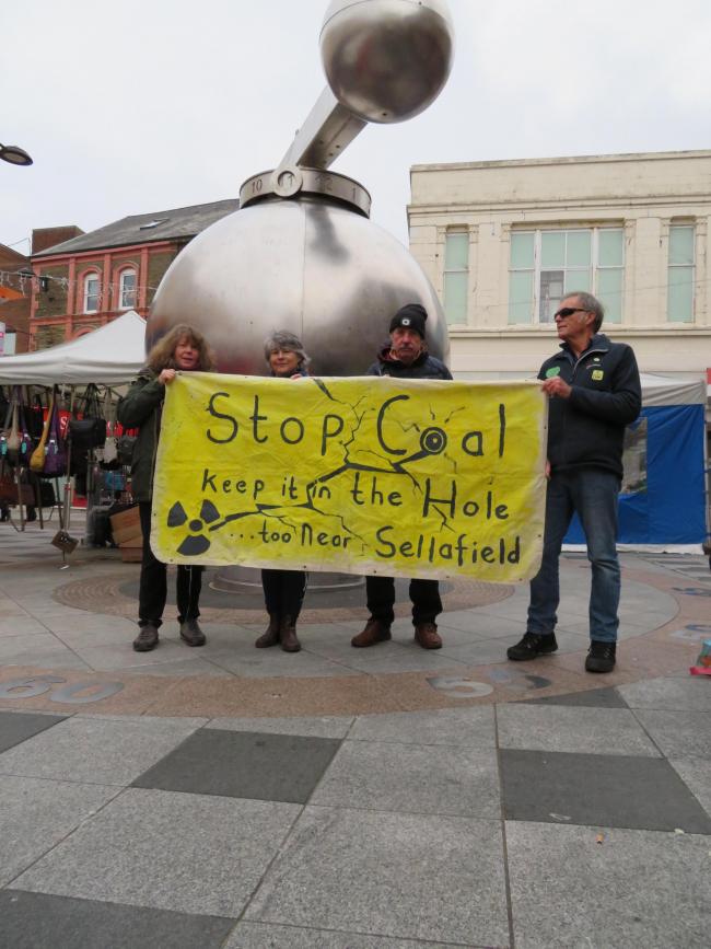 Campaigners stage a protest in Workington town centre on Saturday against plans to resurrect coal mining in West Cumbria