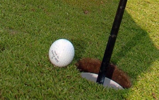 Golfer Joan Yarwood of Nantwich takes her putt..