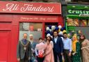 Mayor and mayoress of Carlisle (left), with family and friends of Ali Tandoori
