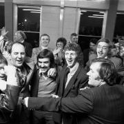 Carlisle United players and staff celebrate in the Cumberland Newspapers officers as news of their promotion comes through