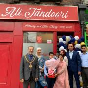Mayor and mayoress of Carlisle (left), with family and friends of Ali Tandoori