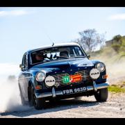 The couple driving a 1966 Volvo Amazon 132S