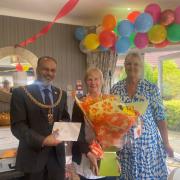 Joy, physio assistant, receives award from Mayor Harid and general manager Janette Lawrence
