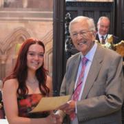Chair of governors Mr Armstrong with Year 13 student Jessica
